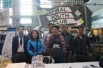Members representing at the Seattle Hmong New Year 2014 at the Seattle Armory